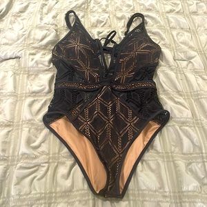 Black tan Becca one piece bathing suit.  Size M